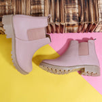 Load image into Gallery viewer, Stylish Block Heeled Chelsea Boots in pink leather with elastic panels on yellow and pink background with wooden texture